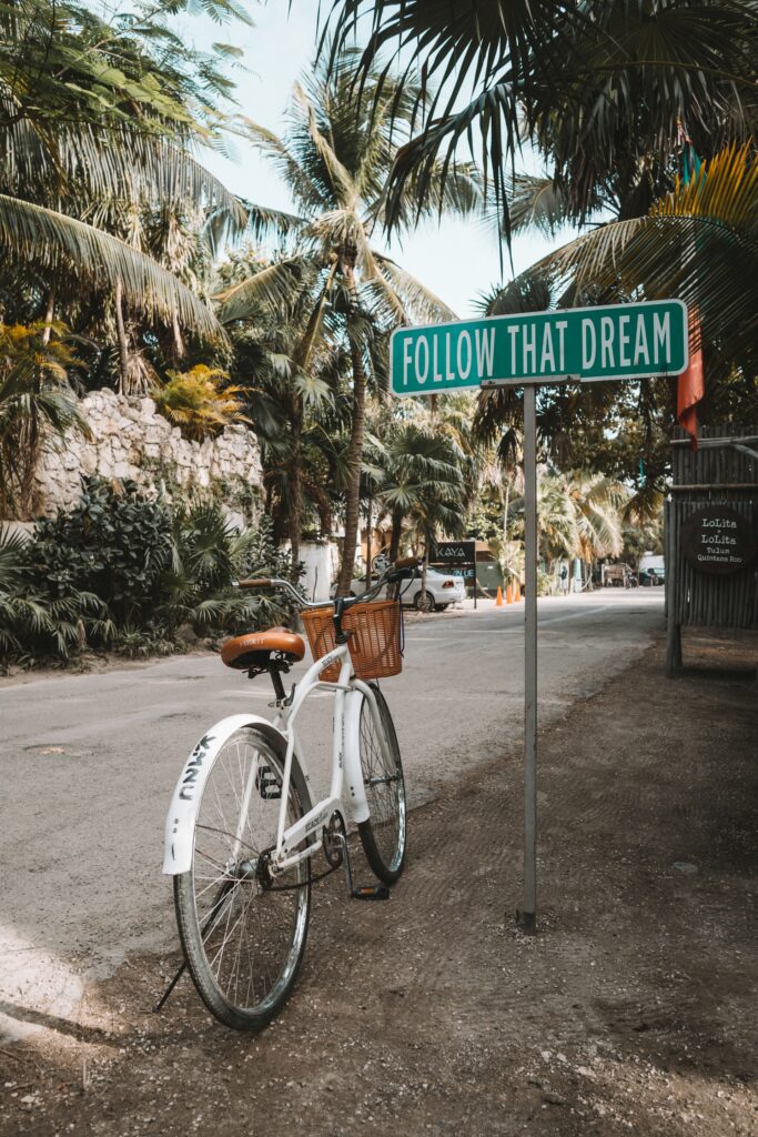 Bike-parked by an inscription saying Follow that dream